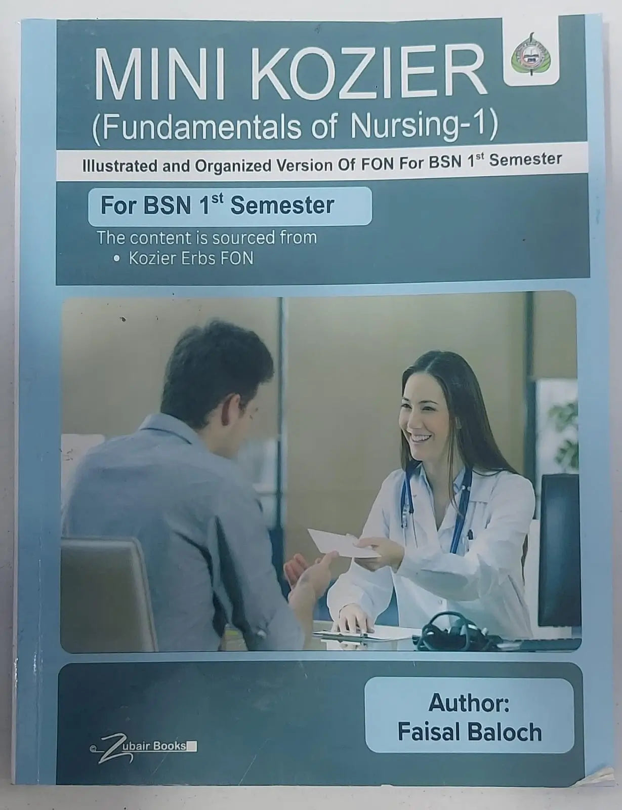 Book cover of 'Mini Kozier Fundamentals of Nursing-1' with a doctor and patient illustration.